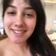 From under the toilet, a very cute girl pushes out a long hanging log that drops, then pisses over the product. Filmed from a between the legs perspective. Vertical format video. Under a minute.
